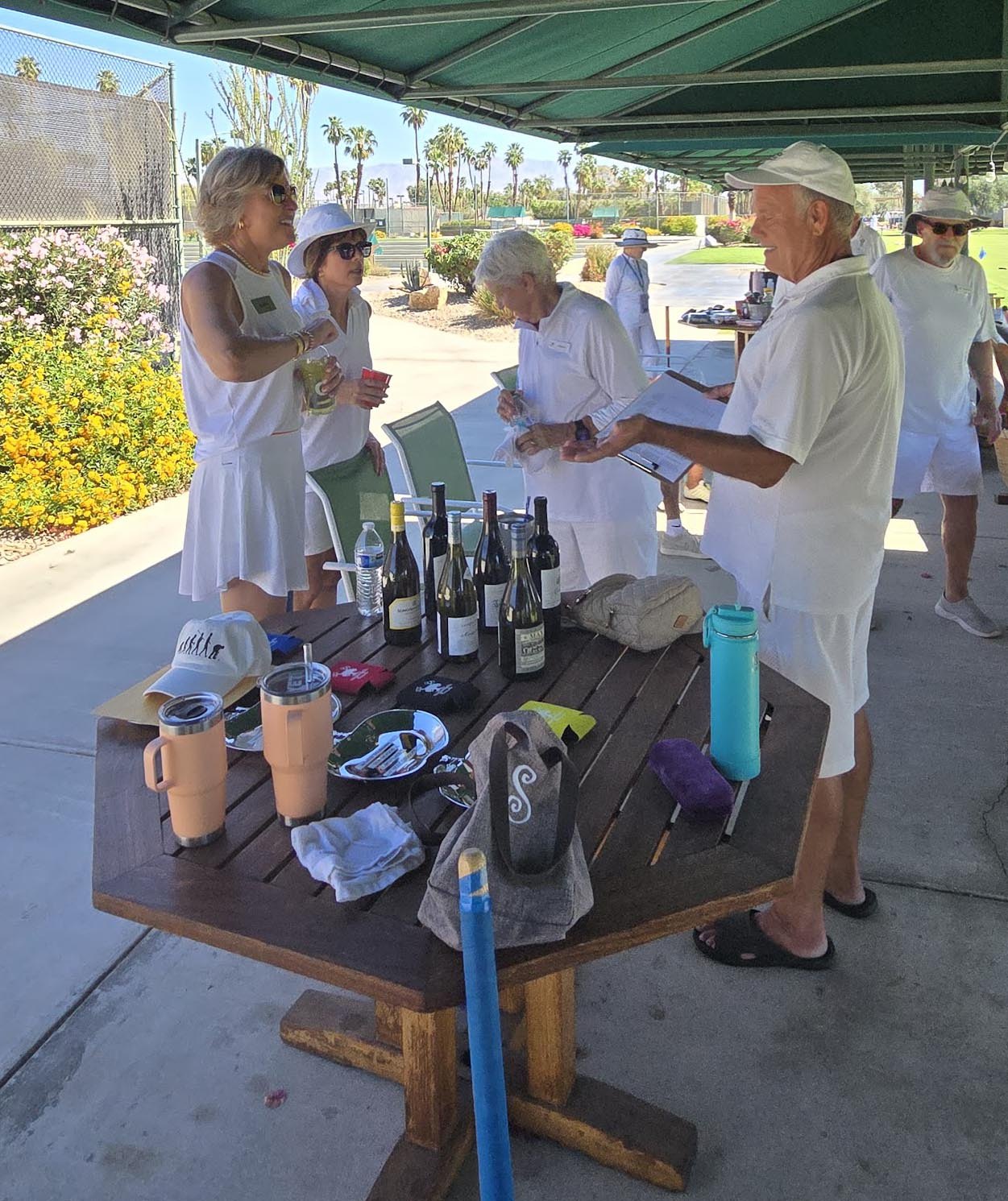 Wine and conversation under the awning
